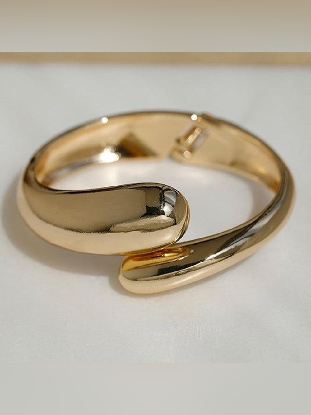 BRAND NEW gold tone curved cuff bracelet